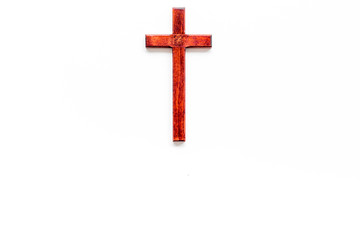 Funeral concept. Wooden cross on white background top view space for text