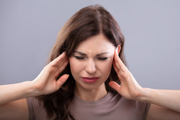 Fototapeta premium Woman Suffering From Headache