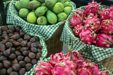 Fresh fruits at a local farmers market. 
Salak, mango and dragon fruit.
