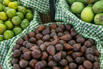 Fresh fruits at a local farmers market. 
Salak, mango and oranges.