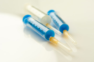 Close-up of a syringe on a light background