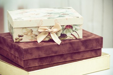 Many gift boxes on white wooden table. Christmas concept. 