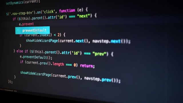 Javascript coding in dark. Captured from an angle.