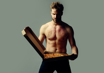 Gay with Pizza. Sexy man with pizza box. Pizza delivery concept. Italian pizzeria. Recipe pizza.