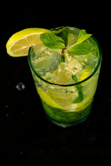Mojito Cocktail with rum, brown sugar, lemon juice, mint and soda water
