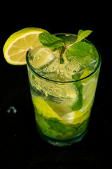 Mojito Cocktail with rum, brown sugar, lemon juice, mint and soda water
