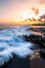 Evening Sunset at a Tropical Rocky Beach