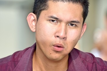 Obraz premium Confused Young Diverse Adult Male