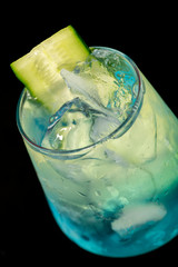 Blue cocktail with blue curacao, mint, gin and cucumber