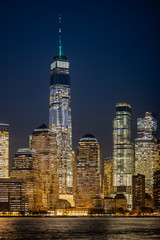 Lower Manhattan cityscape. Illuminated New York city buildings.