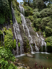 Fototapeta na wymiar Beautiful Twin waterfall cascade in tropical green forest. Banyumala, North Bali, Indonesia, October 2018