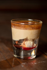 Brain Hemorrhage shot cocktail with schnapps, baileys irish cream and grenadine