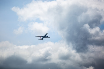 Fototapeta na wymiar Plane and clouds in Portland Oregon