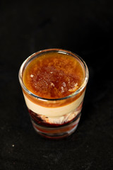 Brain Hemorrhage shot cocktail with schnapps, baileys irish cream and grenadine