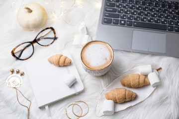 Lady bloggers white work place with business details, laptop, co