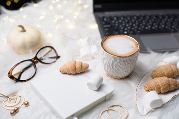 Lady bloggers white work place with business details, laptop, co