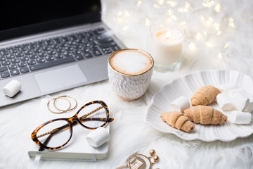 Lady bloggers white work place with business details, laptop, co