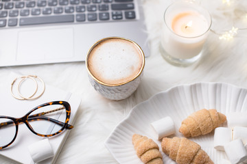 Lady bloggers white work place with business details, laptop, co