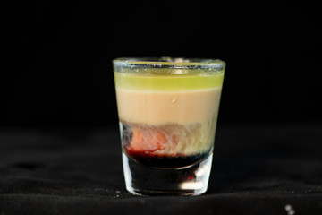 Alien Brain Hemorrhage shot cocktail with schnapps, blue curacao, baileys irish cream and grenadine