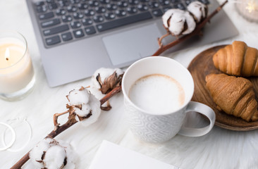 Lady bloggers white work place with business details, laptop, co