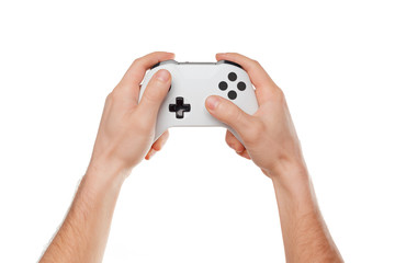 Video game console controller in gamer hands isolated on white background © NewFabrika