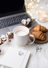 Lady bloggers white work place with business details, laptop, co