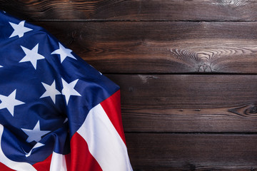 USA flag on dark wooden table background