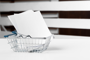 Selective focus of shopping cart or trolley with blank badge paper