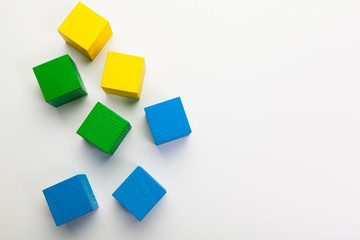 Colorful wooden building blocks isolated on white background