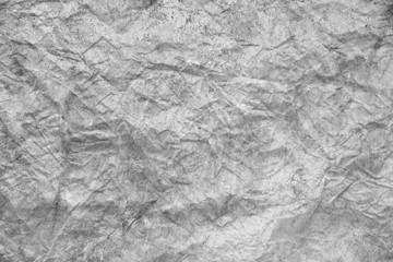 darkness theme. dark background and wallpaper or texture of gray paper old and crumpled have a stain.