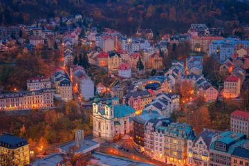 Foto op Plexiglas anti-reflex Beautiful view over colorful houses in Karlovy Vary, a spa town in Czech Republic in autumn season © Evgeni