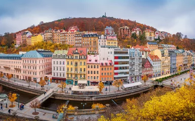 Deurstickers Beautiful view over colorful houses in Karlovy Vary, a spa town in Czech Republic in autumn season © Evgeni