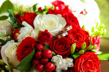 Gold rings on a wedding bouquet