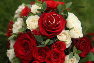 Gold rings on a wedding bouquet