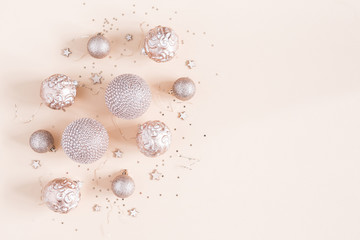 Christmas composition. Christmas decorations on pastel beige background. Flat lay, top view, copy space