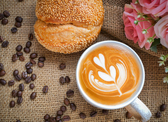 Decoration of cappucino coffee with bread and beans.