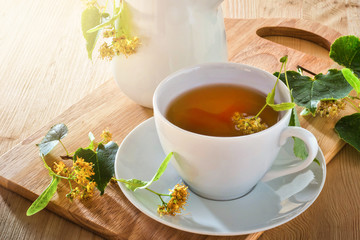 Linden tea on wooden table