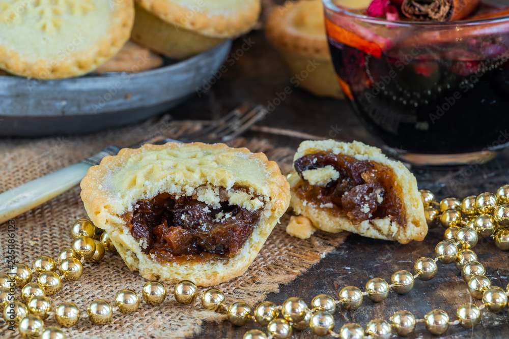 Wall mural traditional christmas mince pies and mulled wine on wooden table