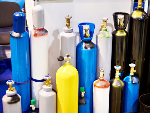 Metal cylinders for compressed gases