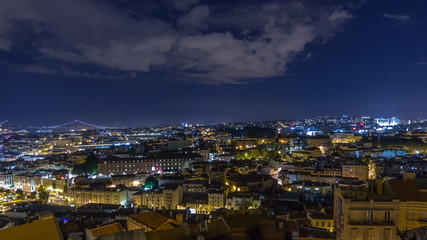 Lisbon aerial panorama view of city centre with illuminated building at Autumn night timelapse, Portugal