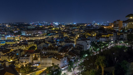 Fototapeta na wymiar Lisbon aerial panorama view of city centre with illuminated building at Autumn night timelapse, Portugal