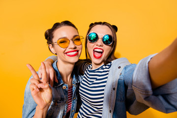 Two glad positive grinning lady stand in glasses spectacles stre