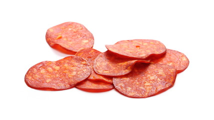 Spicy salami sausage slices isolated on white background