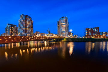 Illuminated appartment buildings during dusk at Oosterheem, Zoetermeer