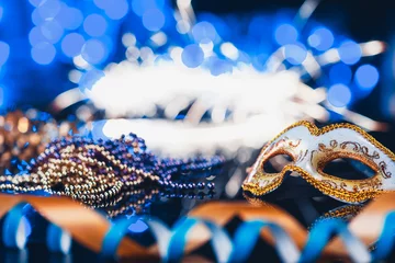 Gordijnen Traditional female carnival venetian mask on blue bokeh background. Masquerade, Venice, Mardi Gras, Brazil festival concept © master1305