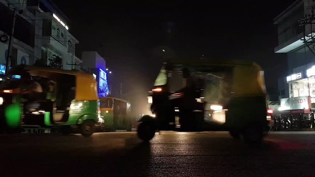 Time lapse of the traffic in the busy T intersection in HSR layout, Bangalore, Karnataka, India during night