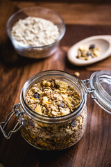 Glass jar with various seeds, oats and cereal.