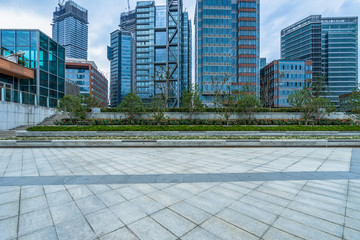 Fototapeta premium empty pavement and modern buildings in city.