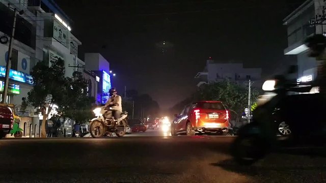 Time lapse of the traffic in the busy T intersection in HSR layout, Bangalore, Karnataka, India during night