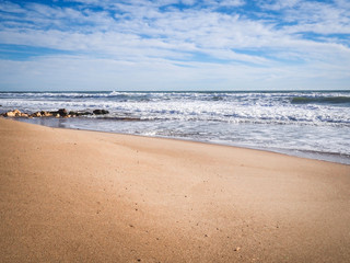 Fototapeta na wymiar Empty beach, sand and the sea